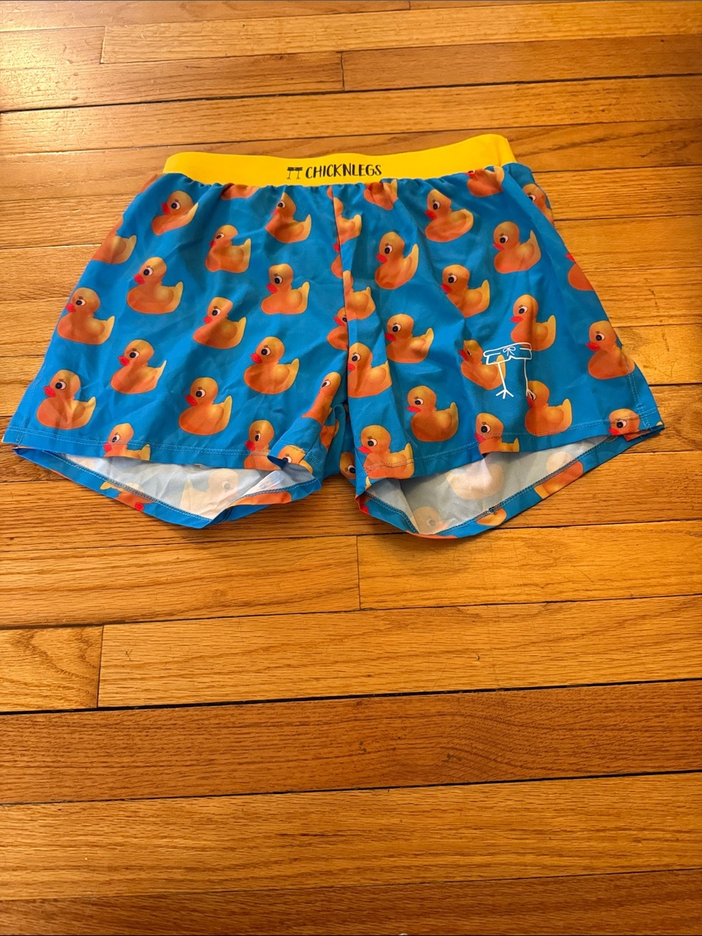 ChicknLegs Women’s Blue Duck-Print Athletic Shorts with Yellow Waistband